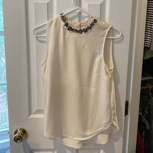 White top with embellished collar